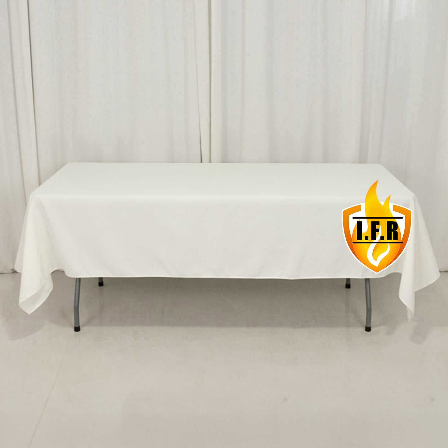 Fire retardant ivory rectangular tablecloth on a table.