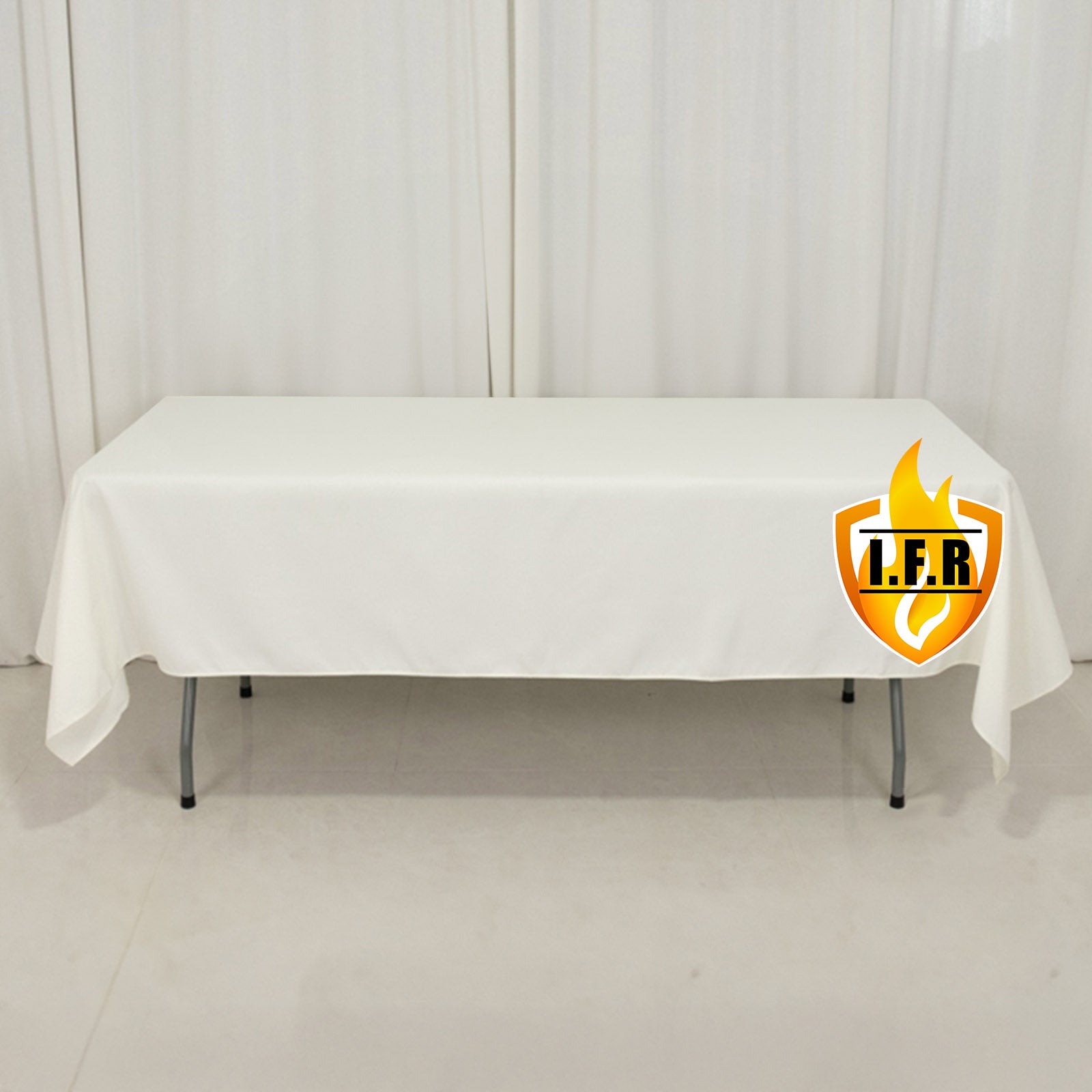 Fire retardant ivory rectangular tablecloth on a table.