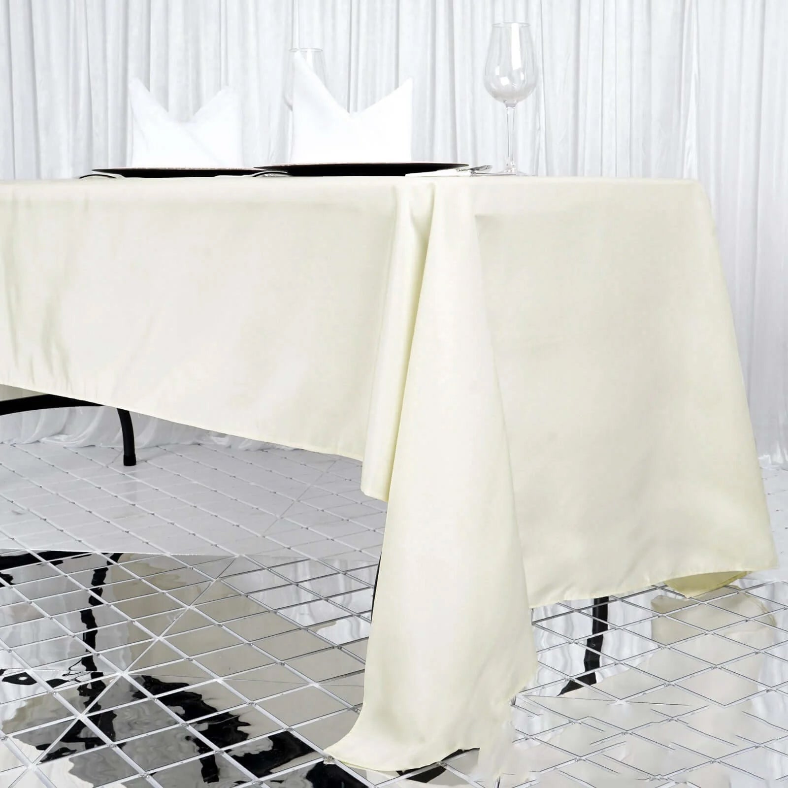 Ivory fire retardant polyester tablecloth on a dining table.