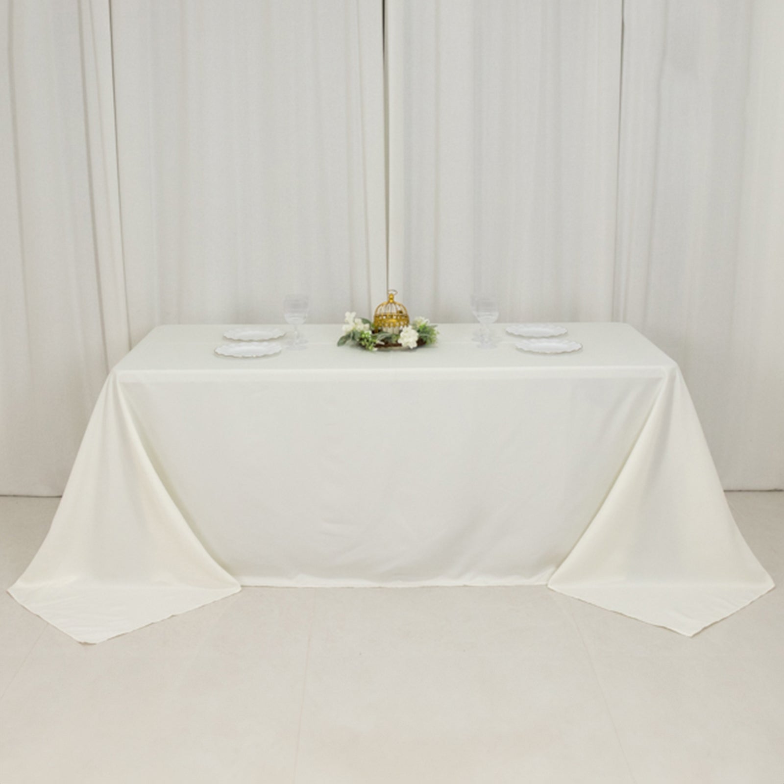 Ivory seamless tablecloth for a 6-foot table with floor-length drop.