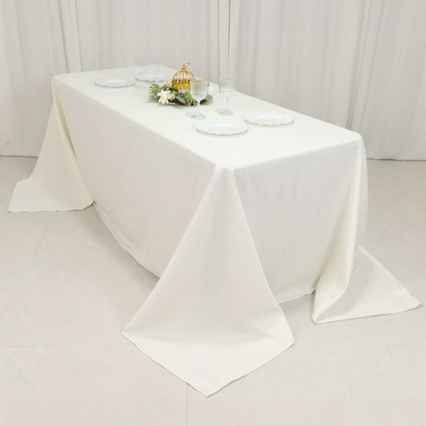Ivory fire retardant tablecloth for 6-foot table with floor-length drop.