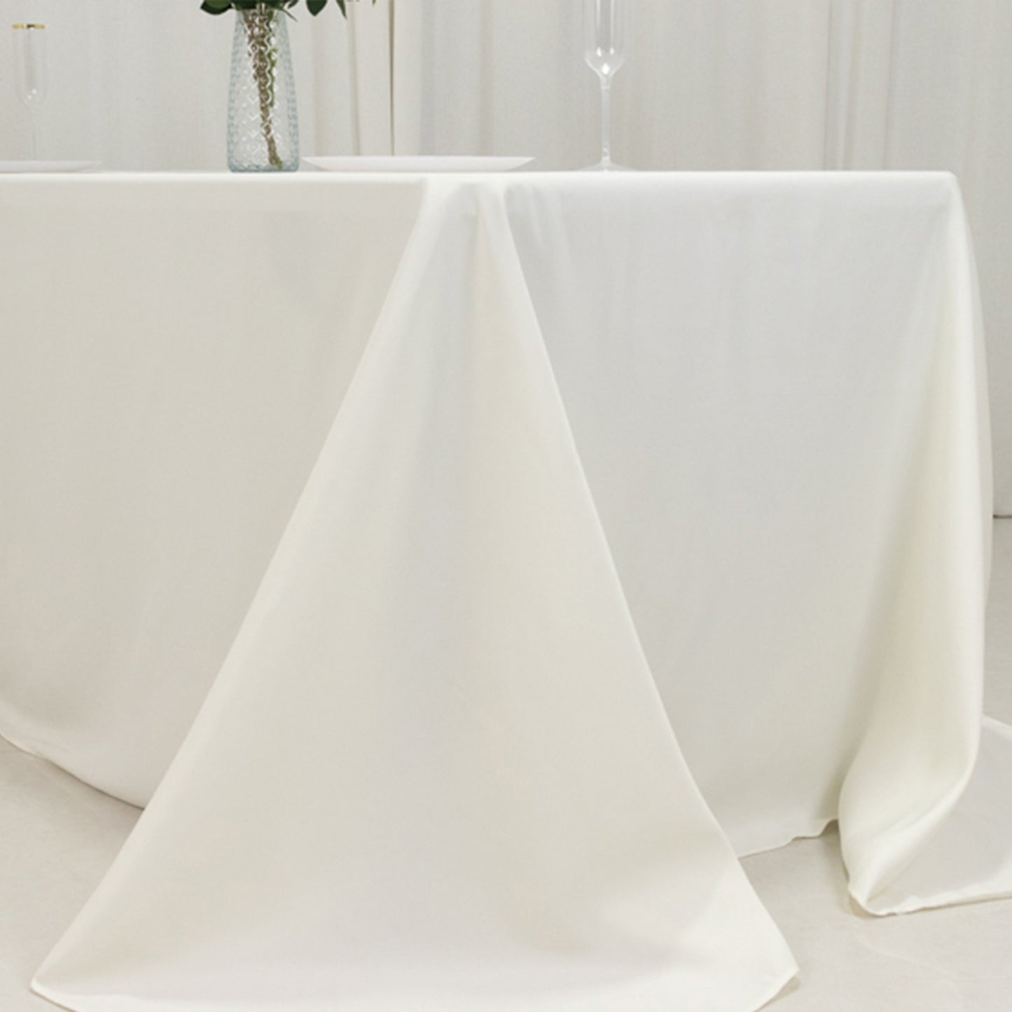 Ivory fire retardant tablecloth for 6-foot table with floor-length drop.