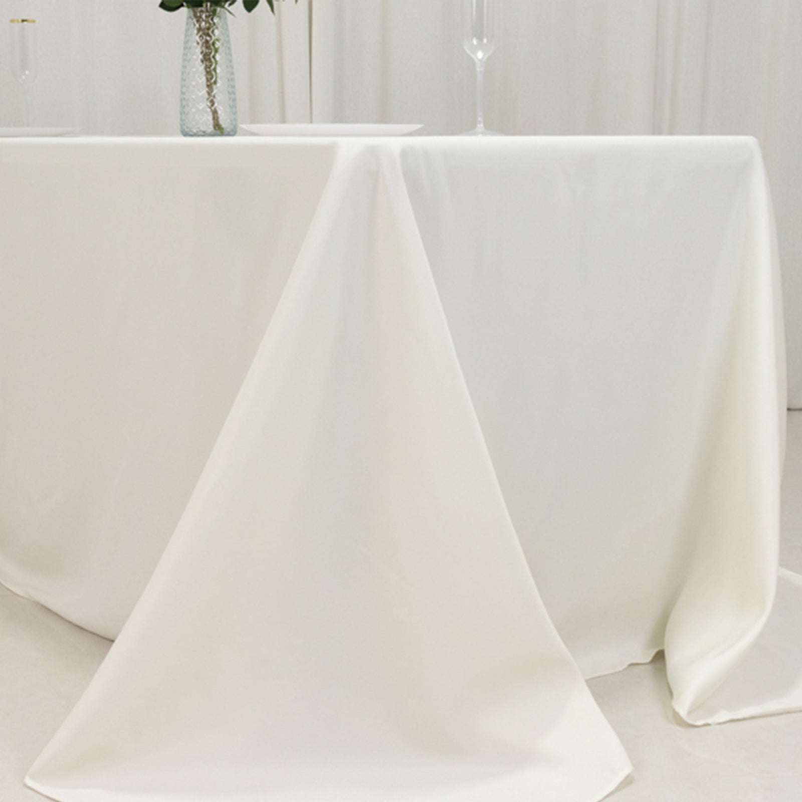 Ivory fire retardant tablecloth for 6-foot table with floor-length drop.