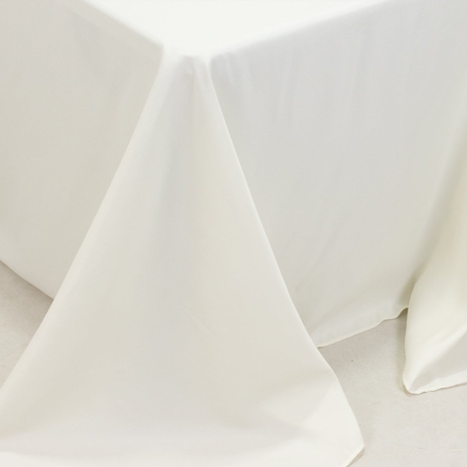 Ivory fire retardant polyester tablecloth for a 6-foot table.