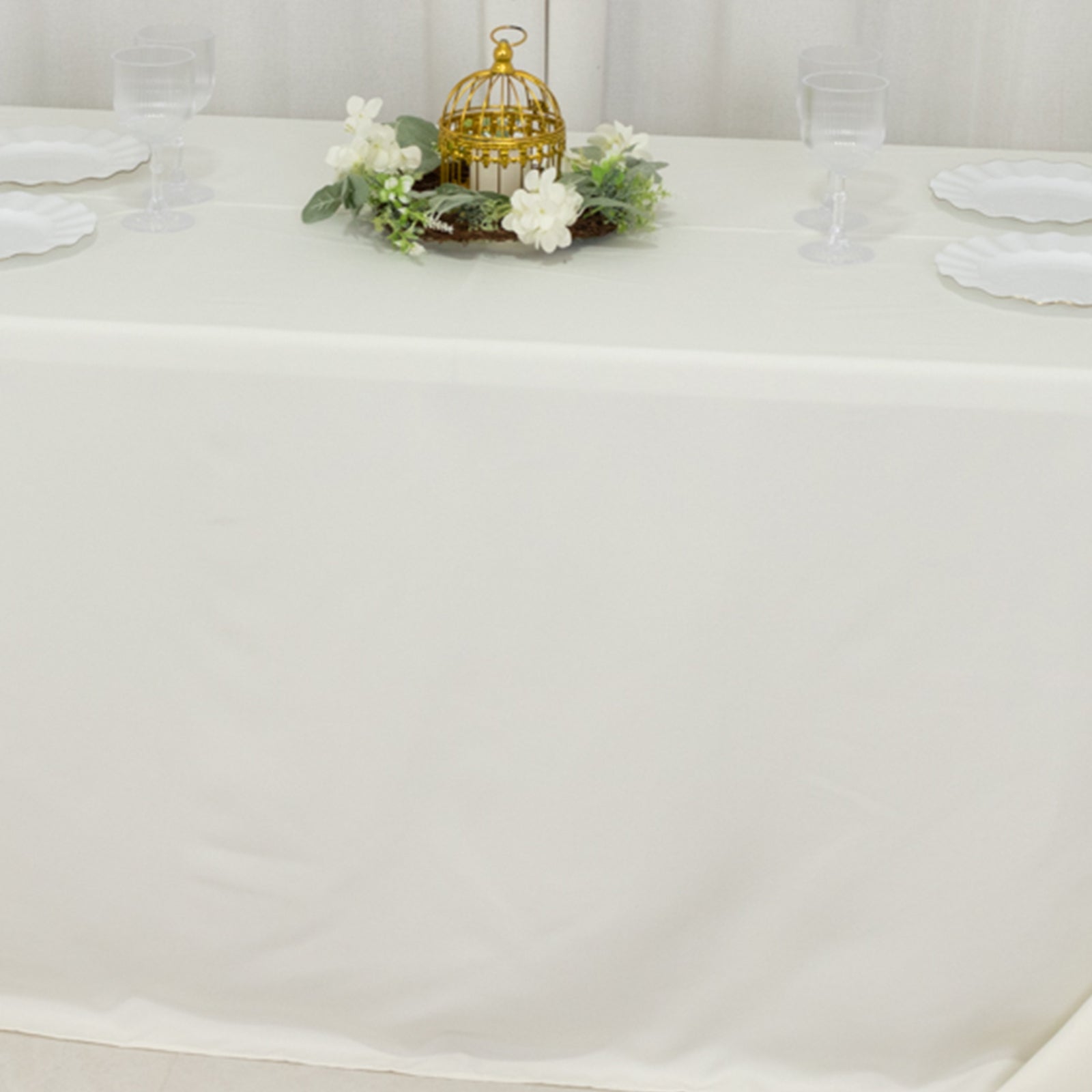 Fire retardant ivory tablecloth for 6-foot table with floor-length drop.