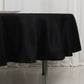 Black fire retardant round table cover on a table.
