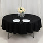 Black fire retardant round tablecloth with elegant table setting.