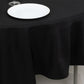 Black fire retardant round tablecloth on a table.
