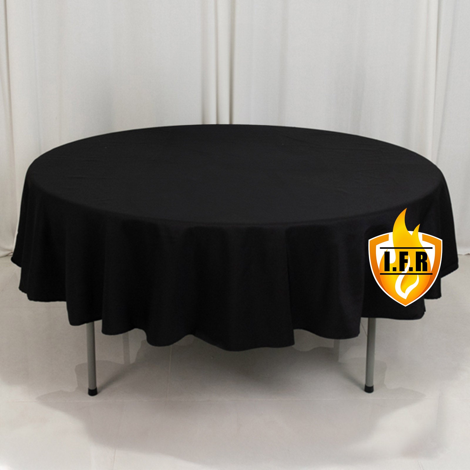 Black fire retardant round tablecloth on a table.