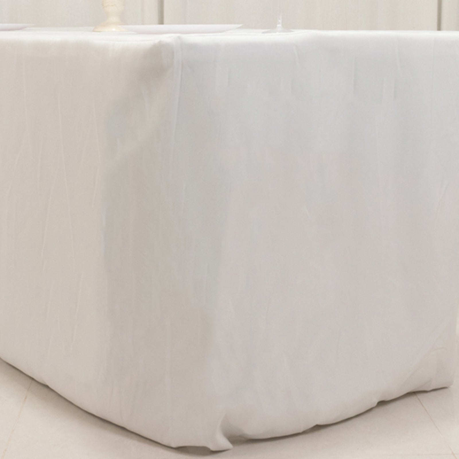 White fitted tablecloth for 72"x30" tables, made of premium polyester.