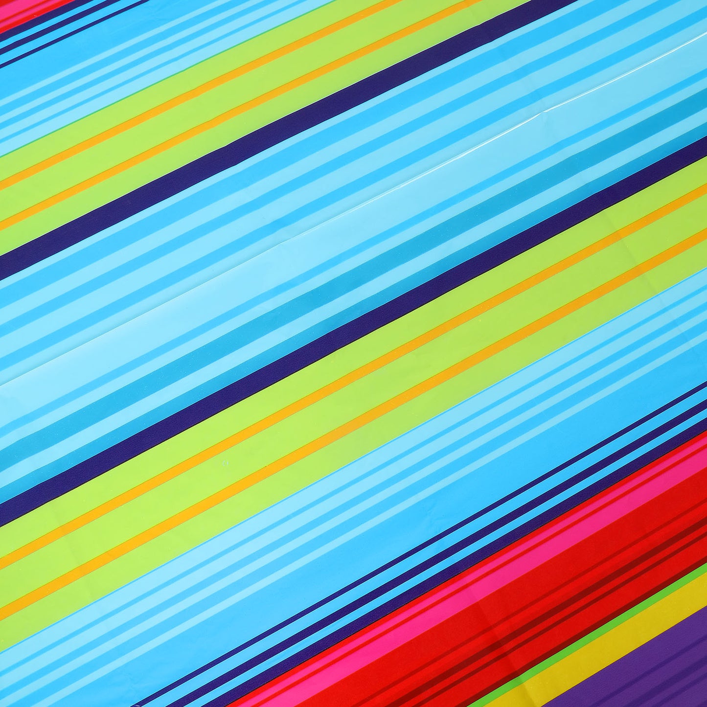 Colorful striped table cover in blue, green, and red for Cinco de Mayo.
