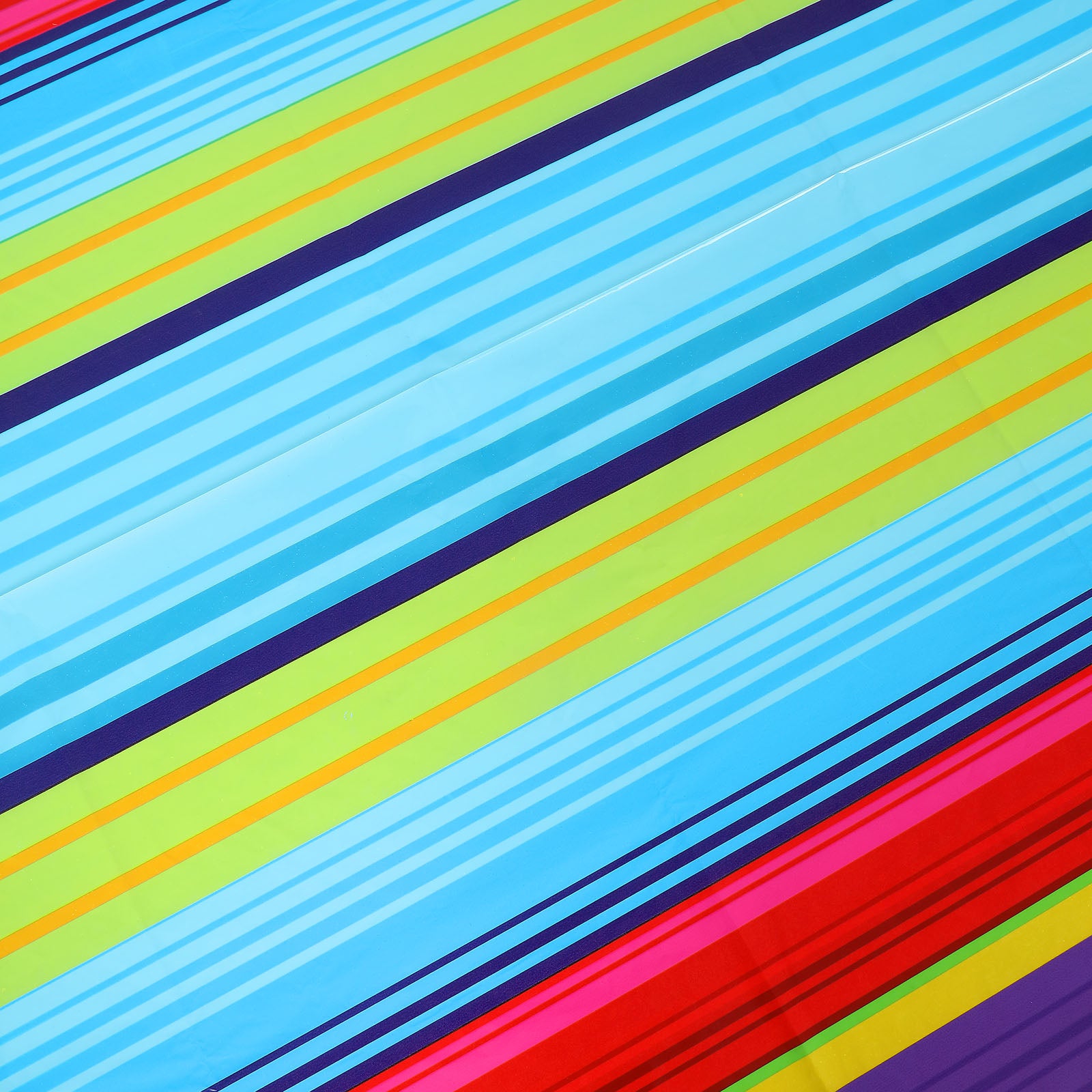 Colorful striped table cover in blue, green, and red for Cinco de Mayo.