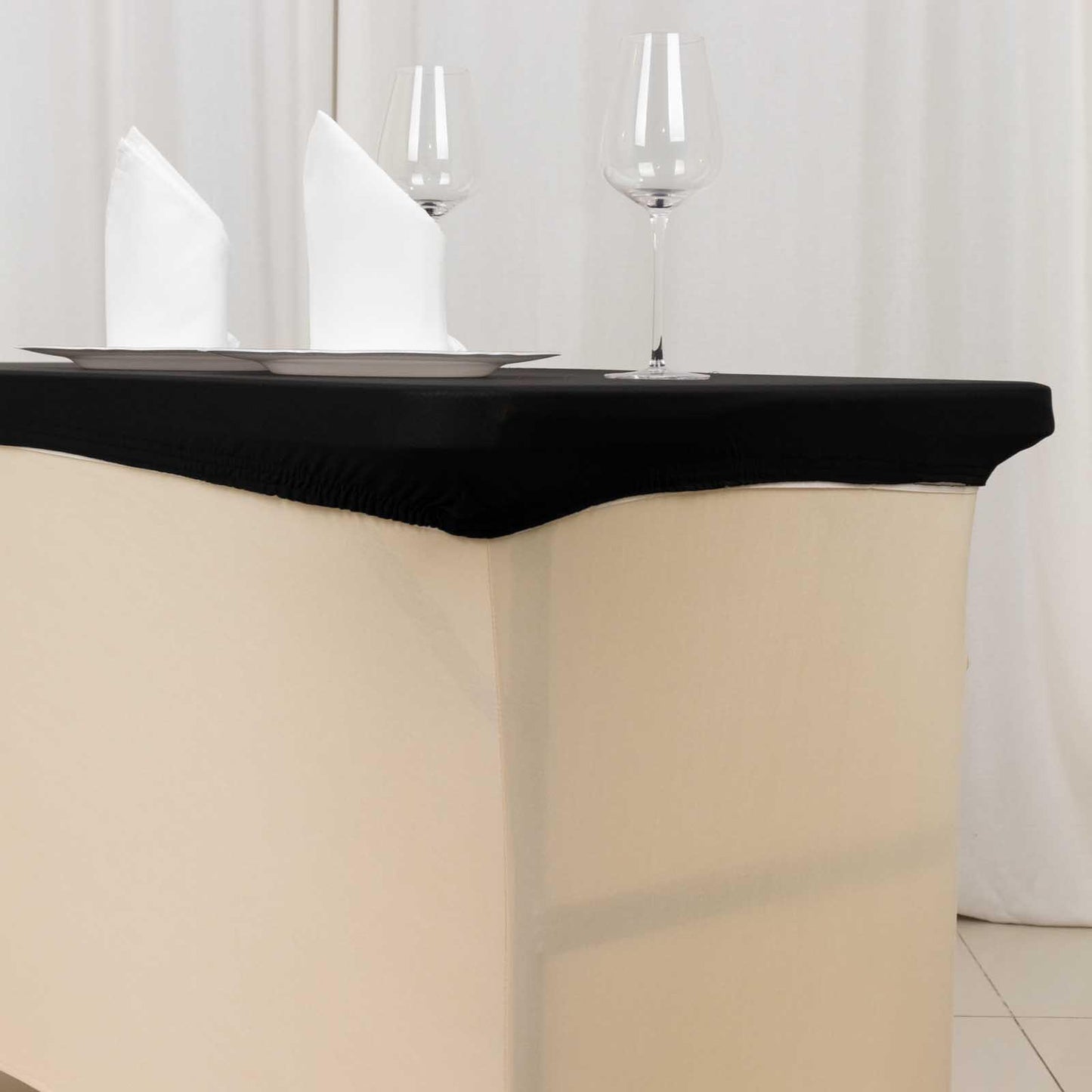 Black fitted tablecloth cover for 48"x30" tables. Wrinkle-free spandex material.