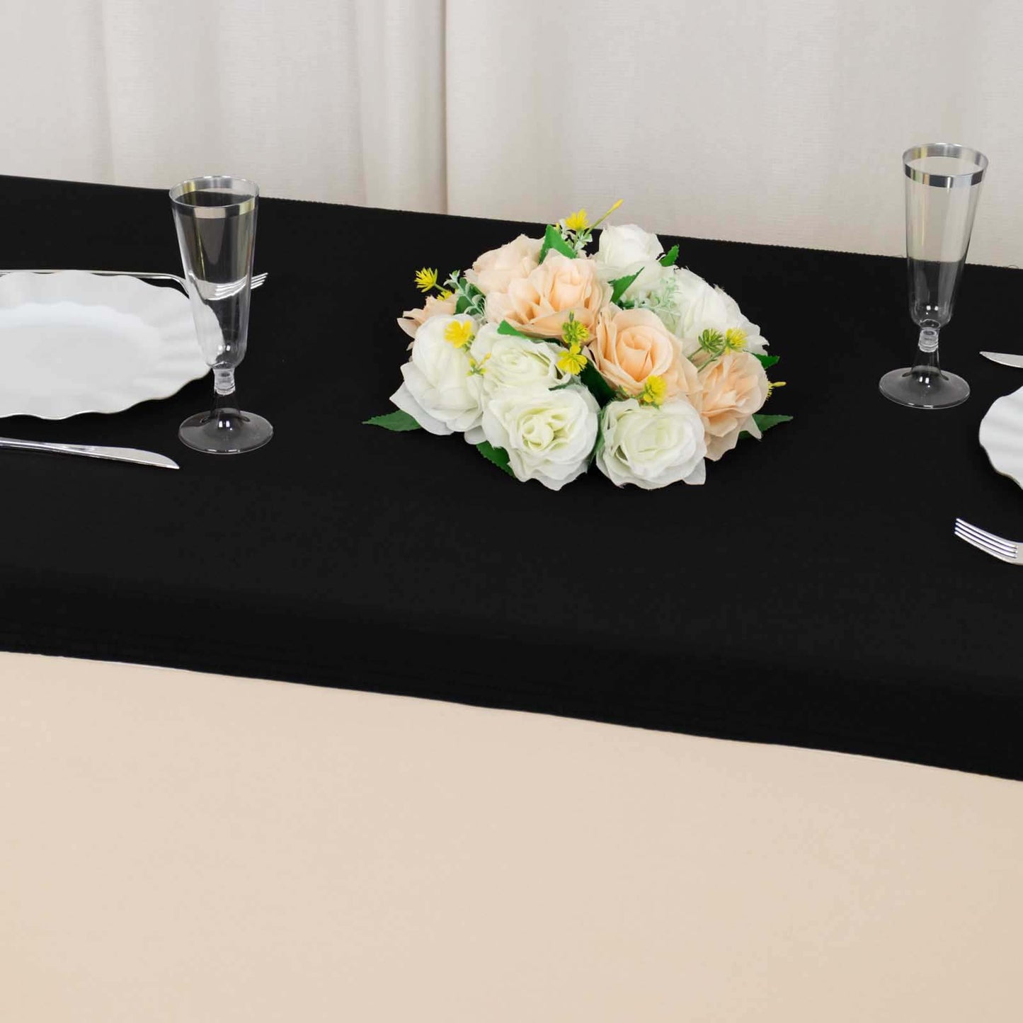 Black fitted tablecloth cover for 48"x30" tables with floral centerpiece.