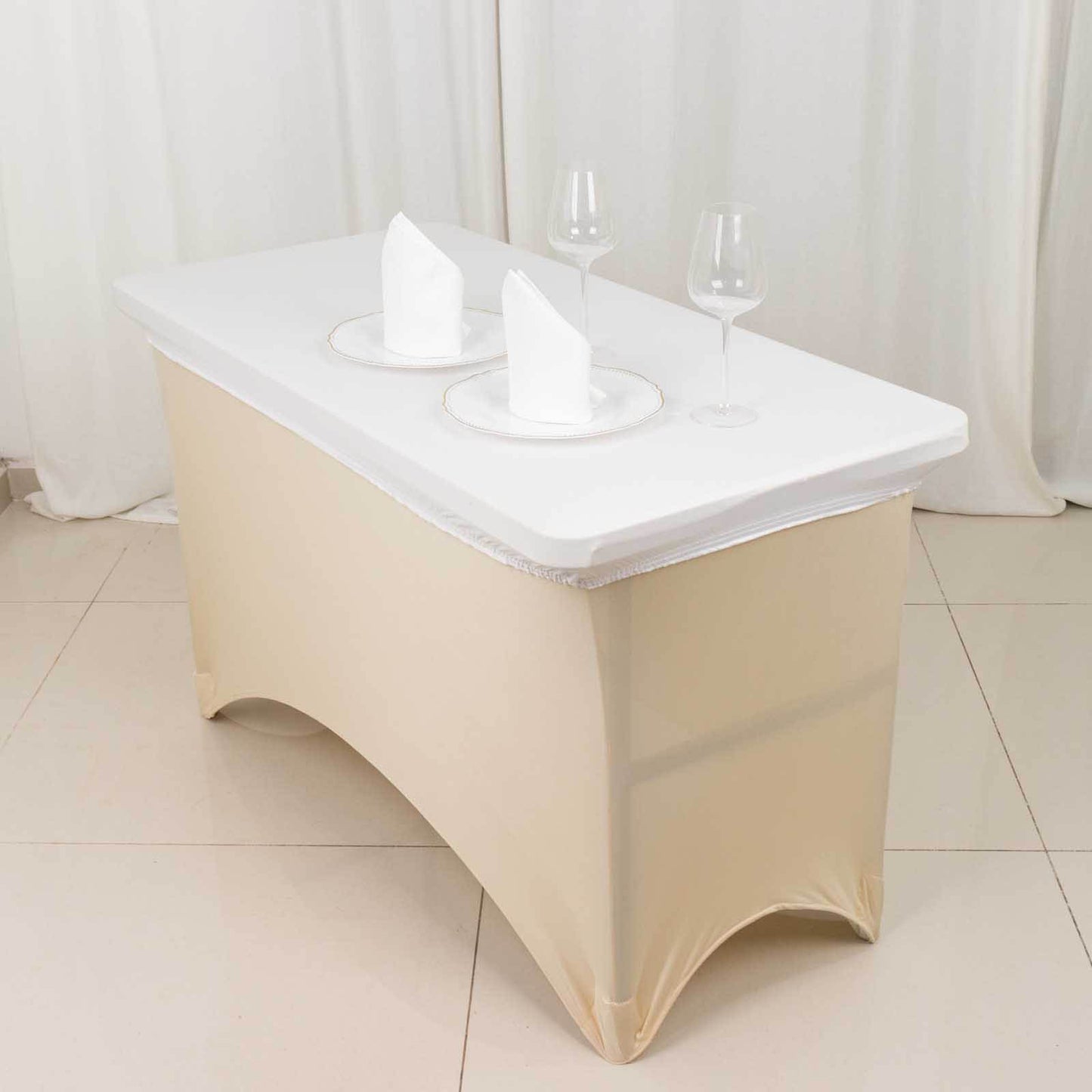 White fitted tablecloth cover for 48"x30" tables, wrinkle-free design.