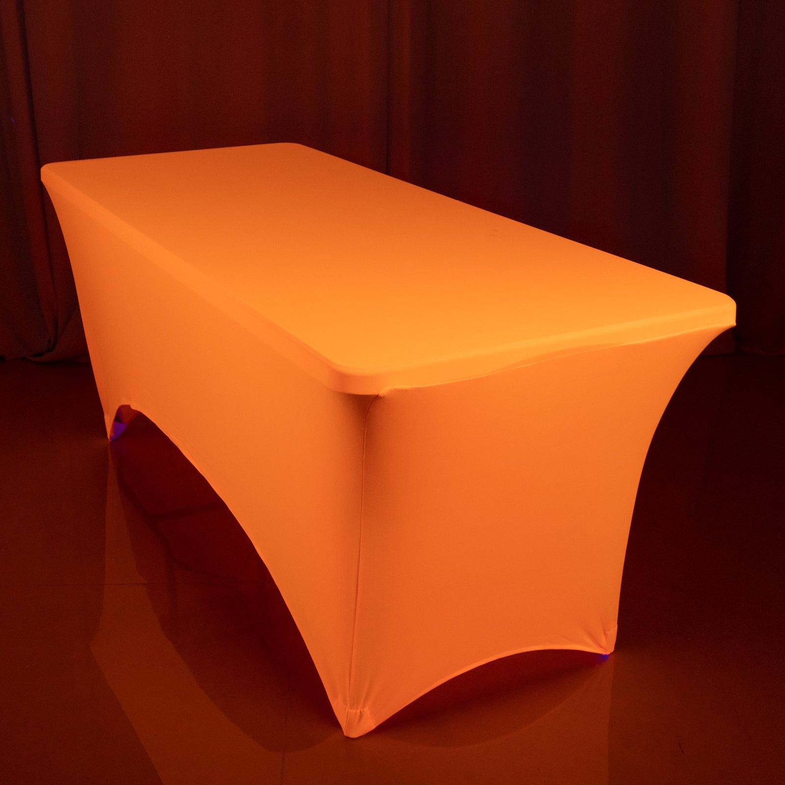 Glow Neon Orange Fitted Spandex Tablecloth on a 6ft rectangle table.