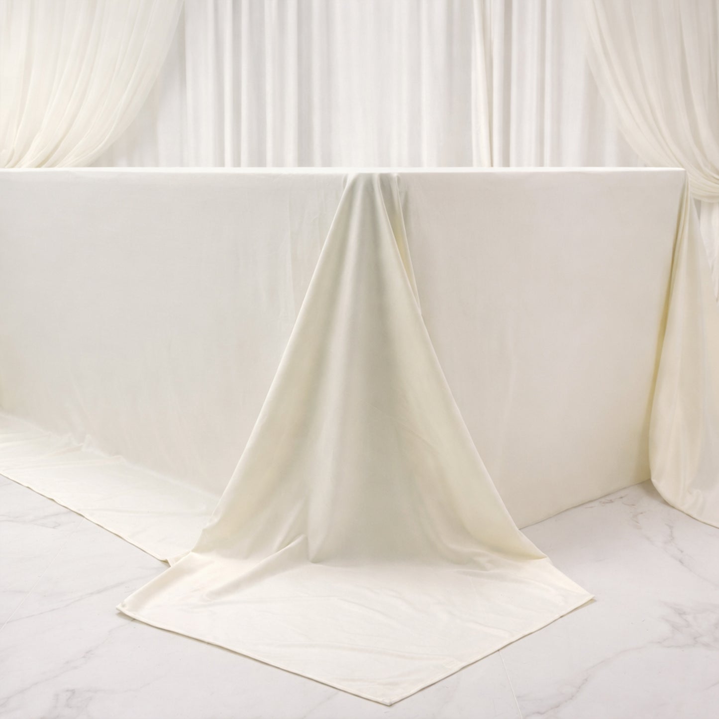 Ivory rectangular tablecloth for 8ft tables, wrinkle-free and stain-resistant.