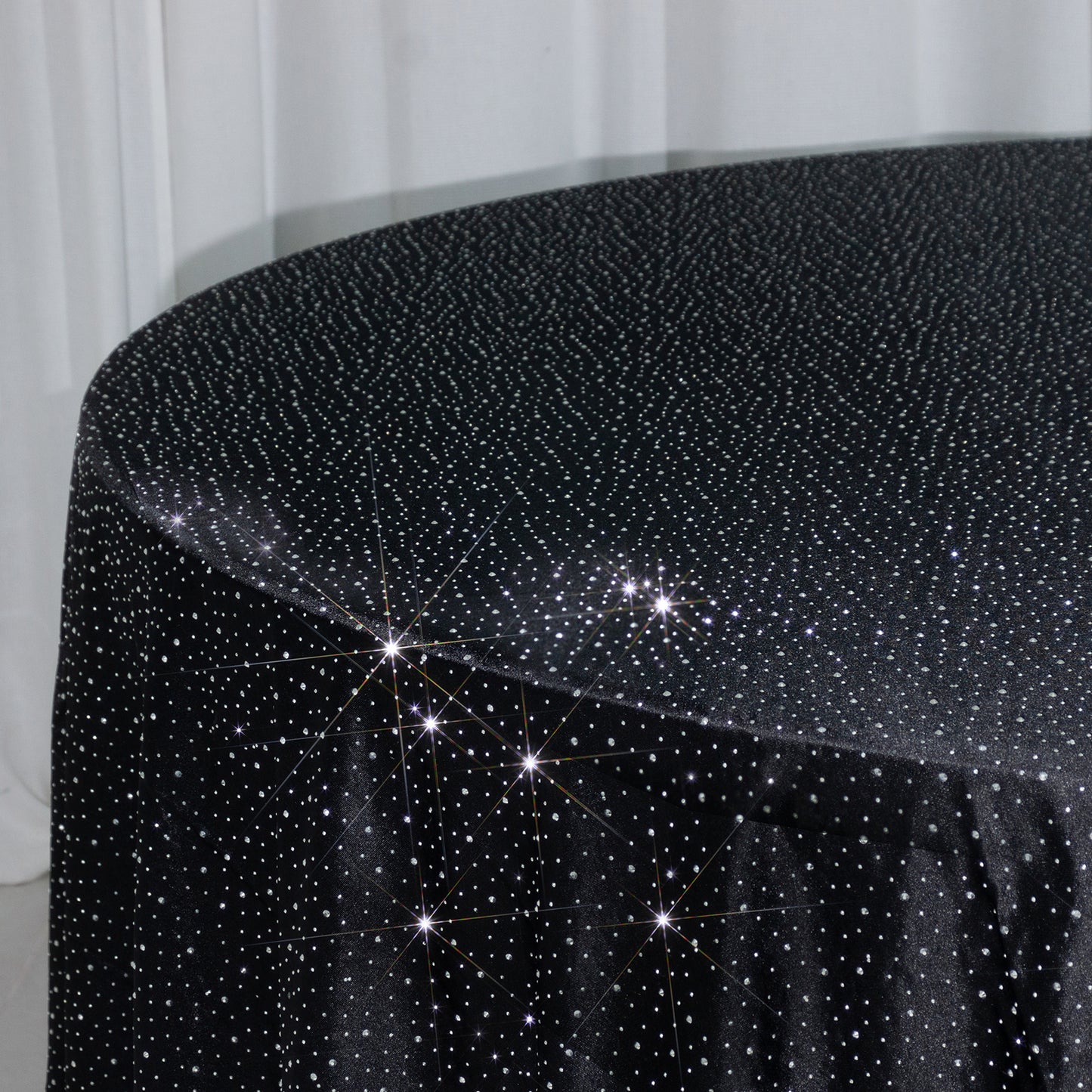 Black round tablecloth with rhinestone accents, seamless and stain-resistant.