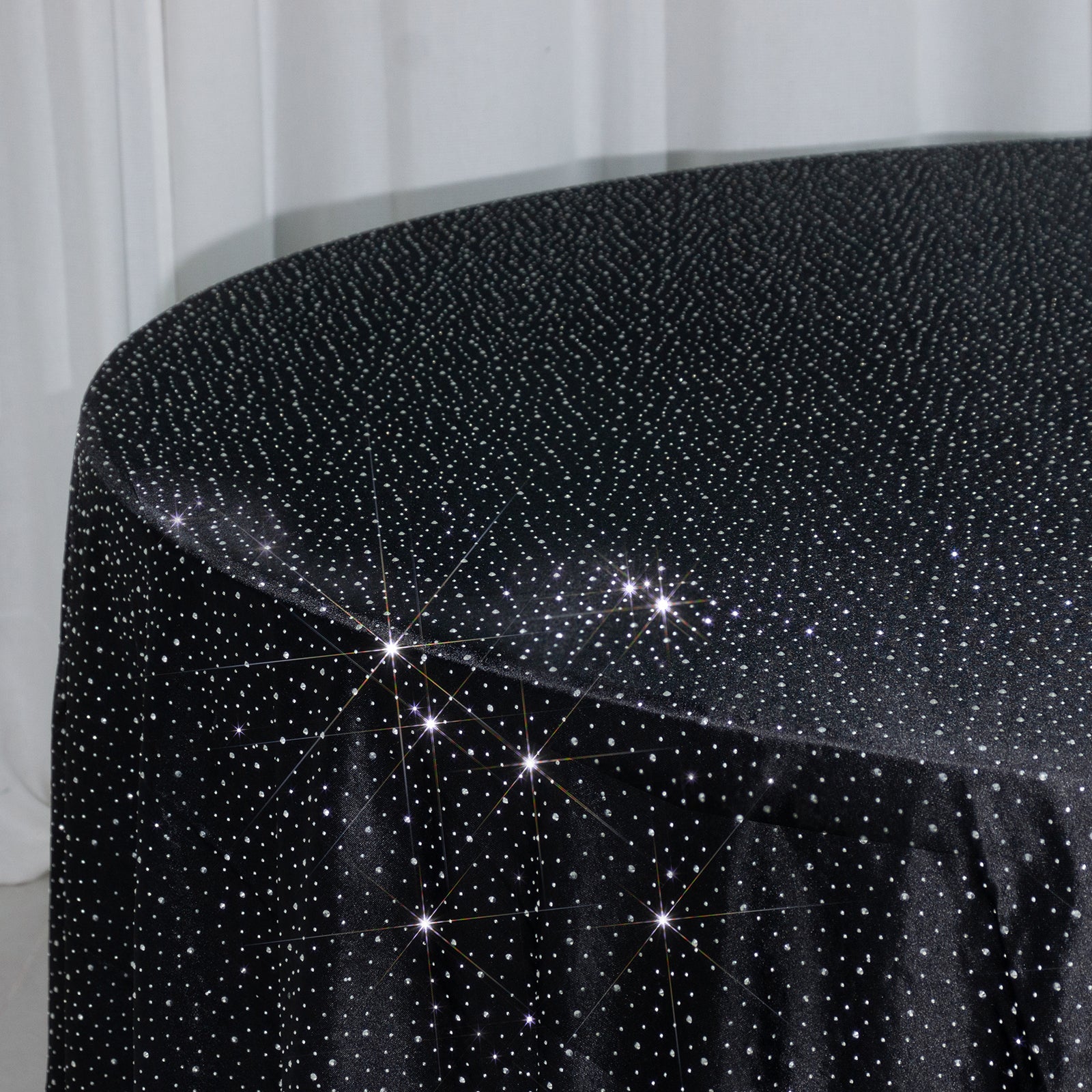 Black round tablecloth with rhinestone accents, seamless and stain-resistant.
