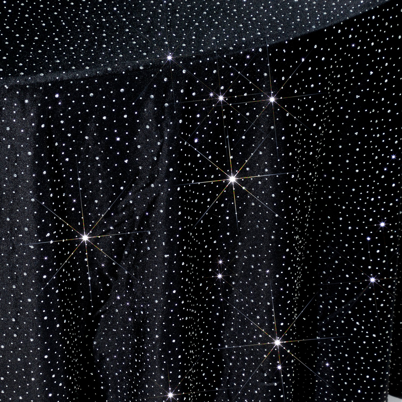 Black round tablecloth with rhinestone accents, seamless and wrinkle-free.