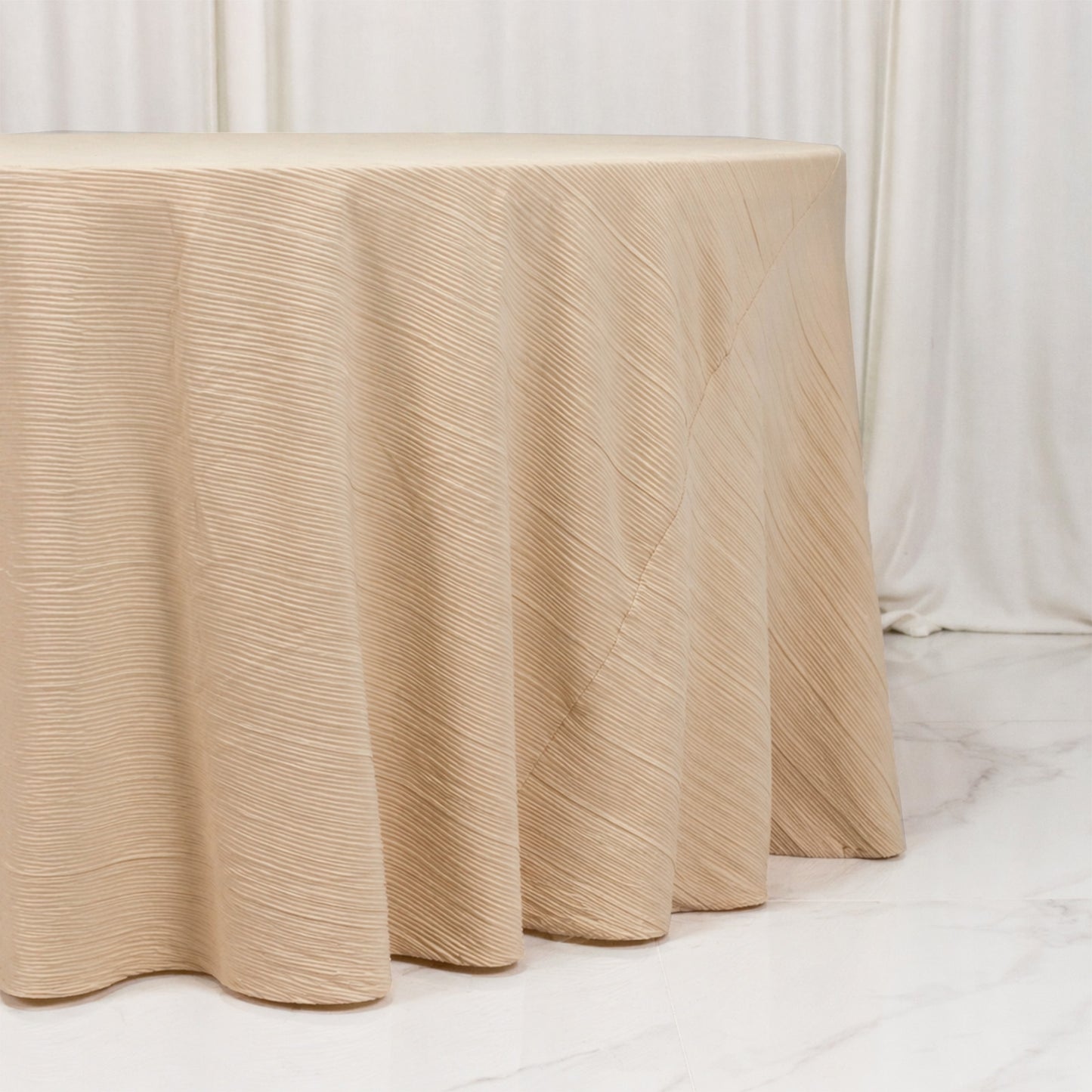 Beige accordion pleated scuba tablecloth, wrinkle-free and stain-resistant.