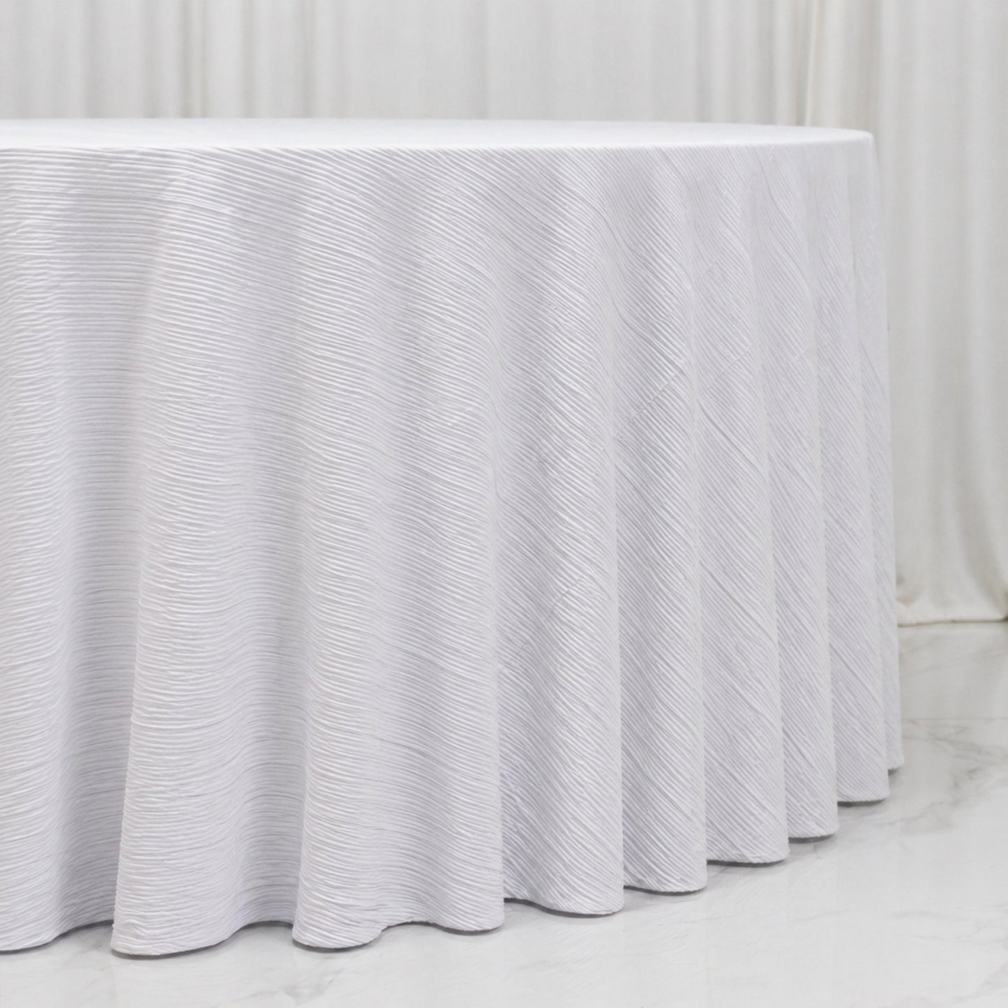White accordion pleated scuba tablecloth, wrinkle-free and stain-resistant.