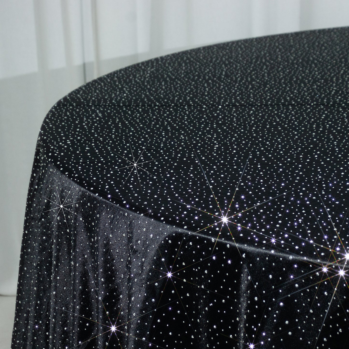 Black round tablecloth with rhinestone accents, seamless and wrinkle-free.