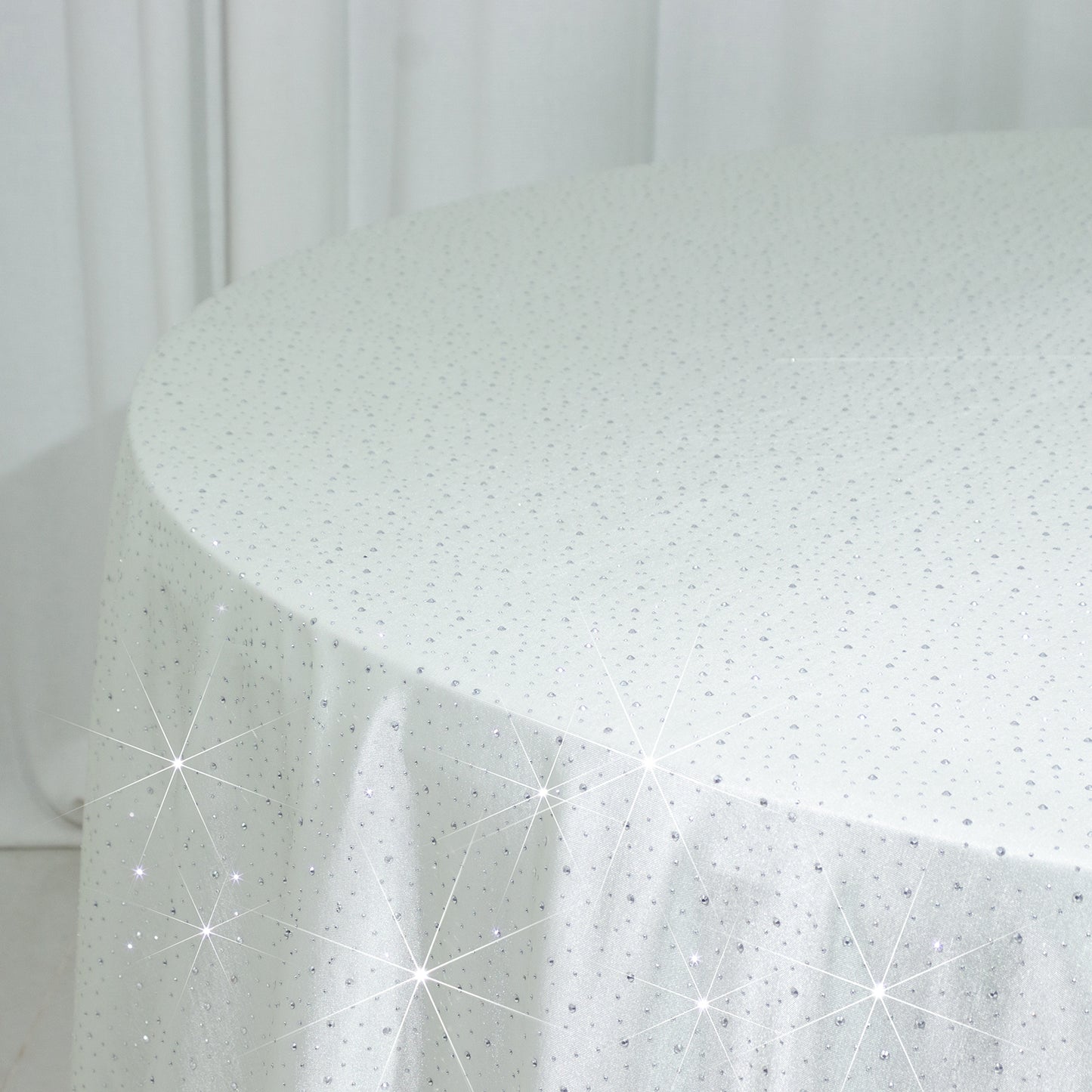 Pearl white round tablecloth with rhinestone accents, seamless and wrinkle-free.