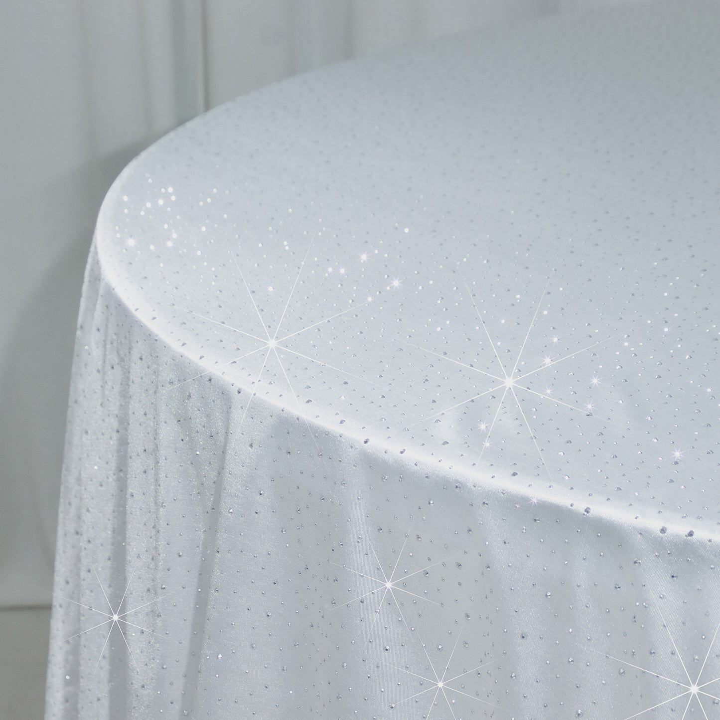 White round tablecloth with rhinestone accents, seamless and wrinkle-free.