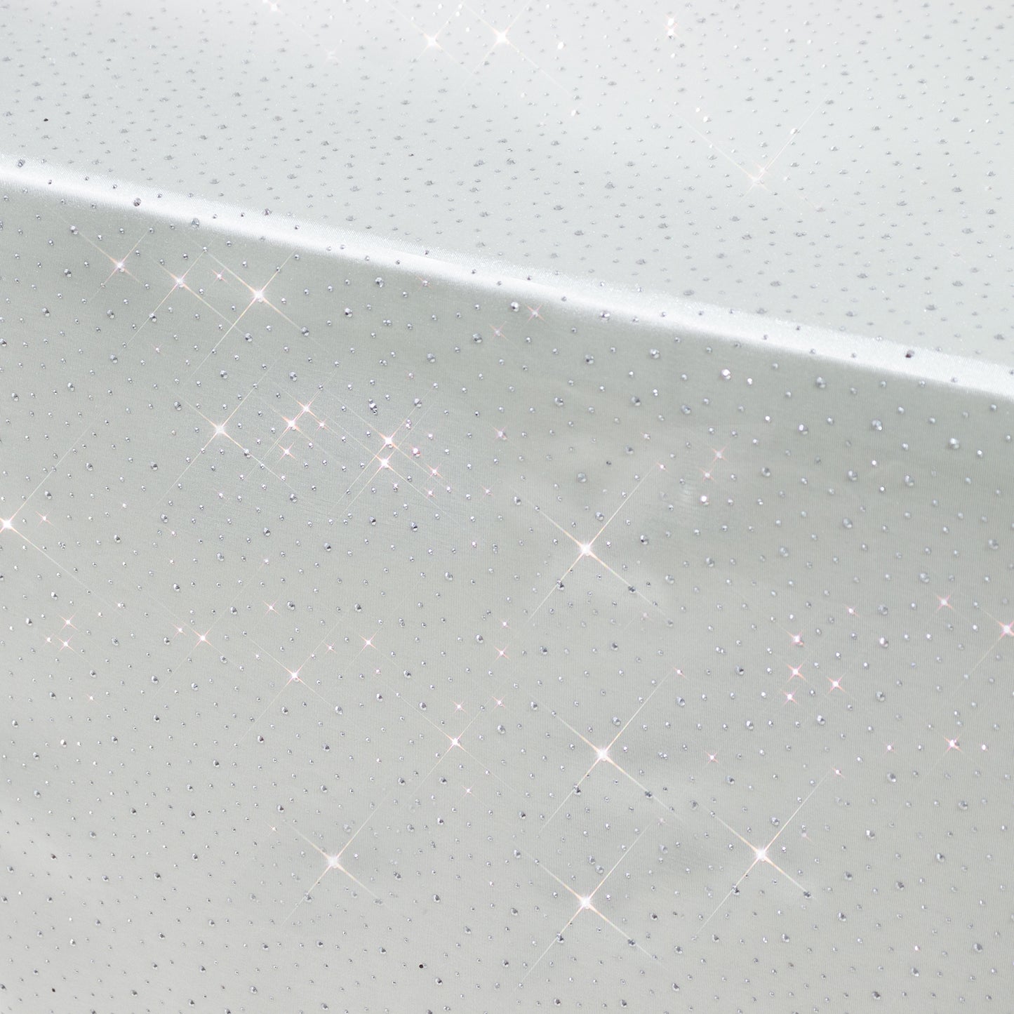 Pearl white rectangular tablecloth with rhinestone accents, seamless and wrinkle-free.