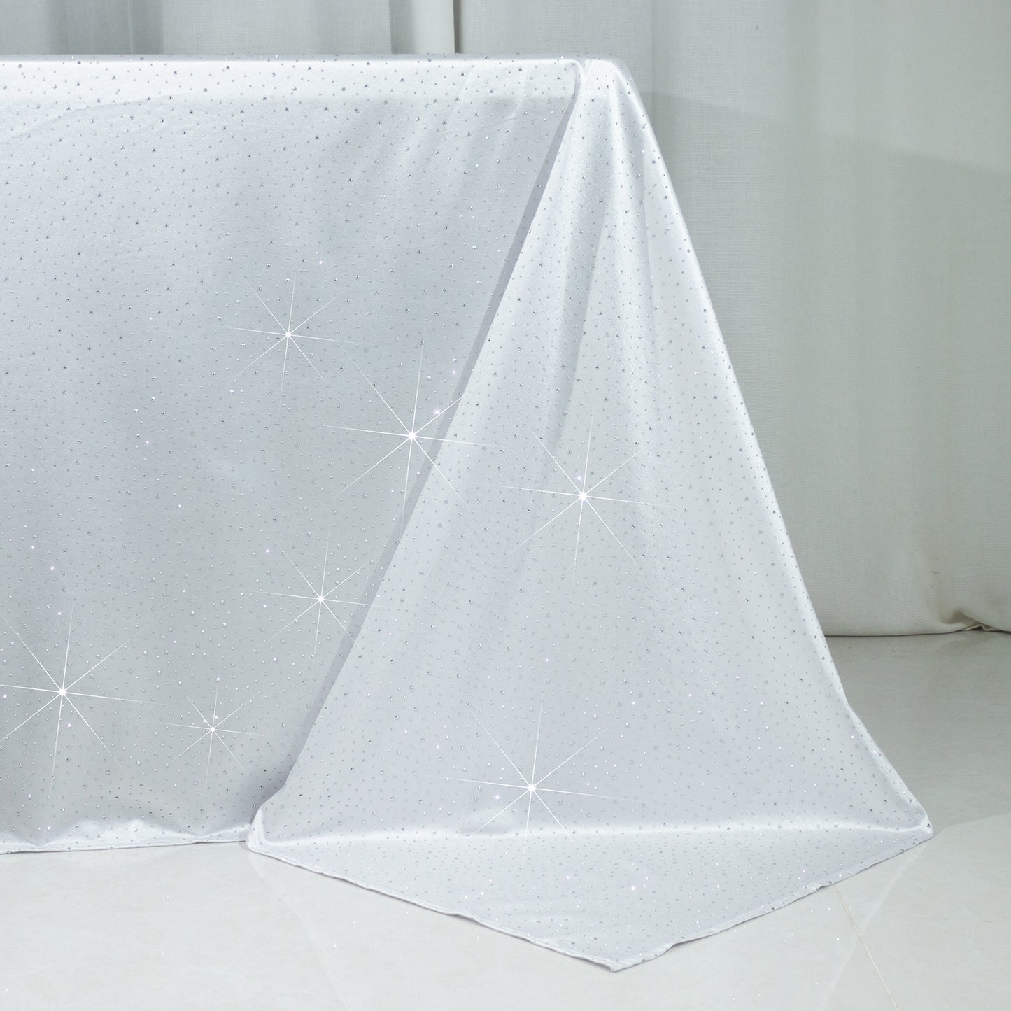 Black rectangular tablecloth with rhinestone accents, seamless and wrinkle-free.