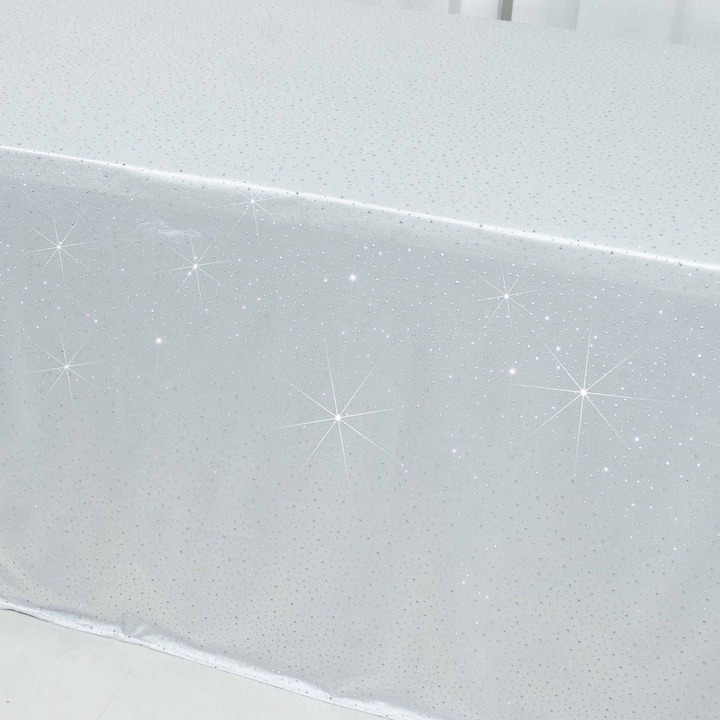 White rectangular tablecloth with rhinestone accents, seamless and wrinkle-free.