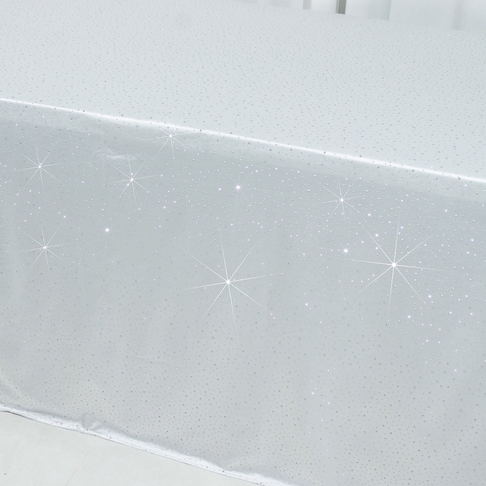 White rectangular tablecloth with rhinestone accents, seamless and wrinkle-free.