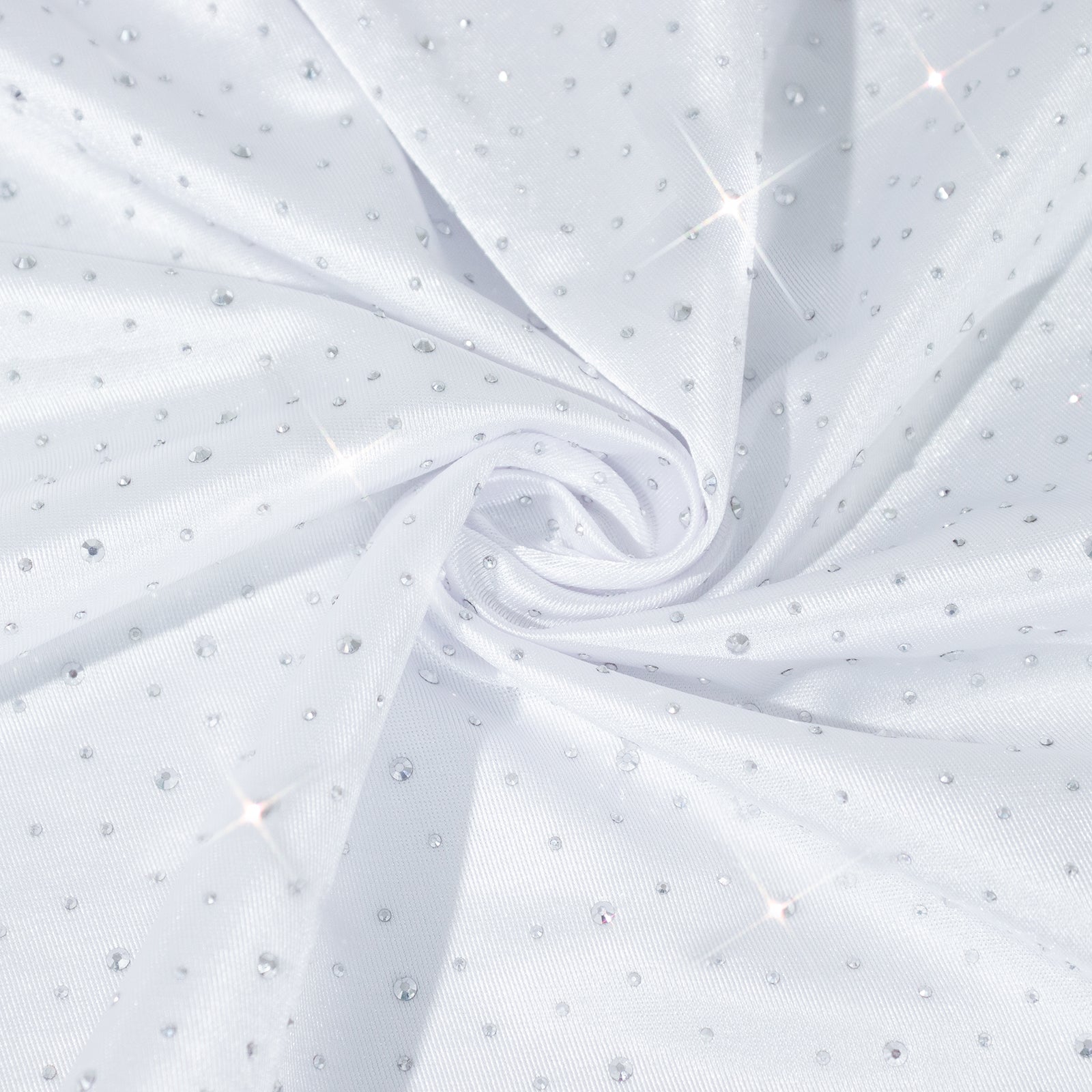 White tablecloth with rhinestone accents, seamless and wrinkle-free.