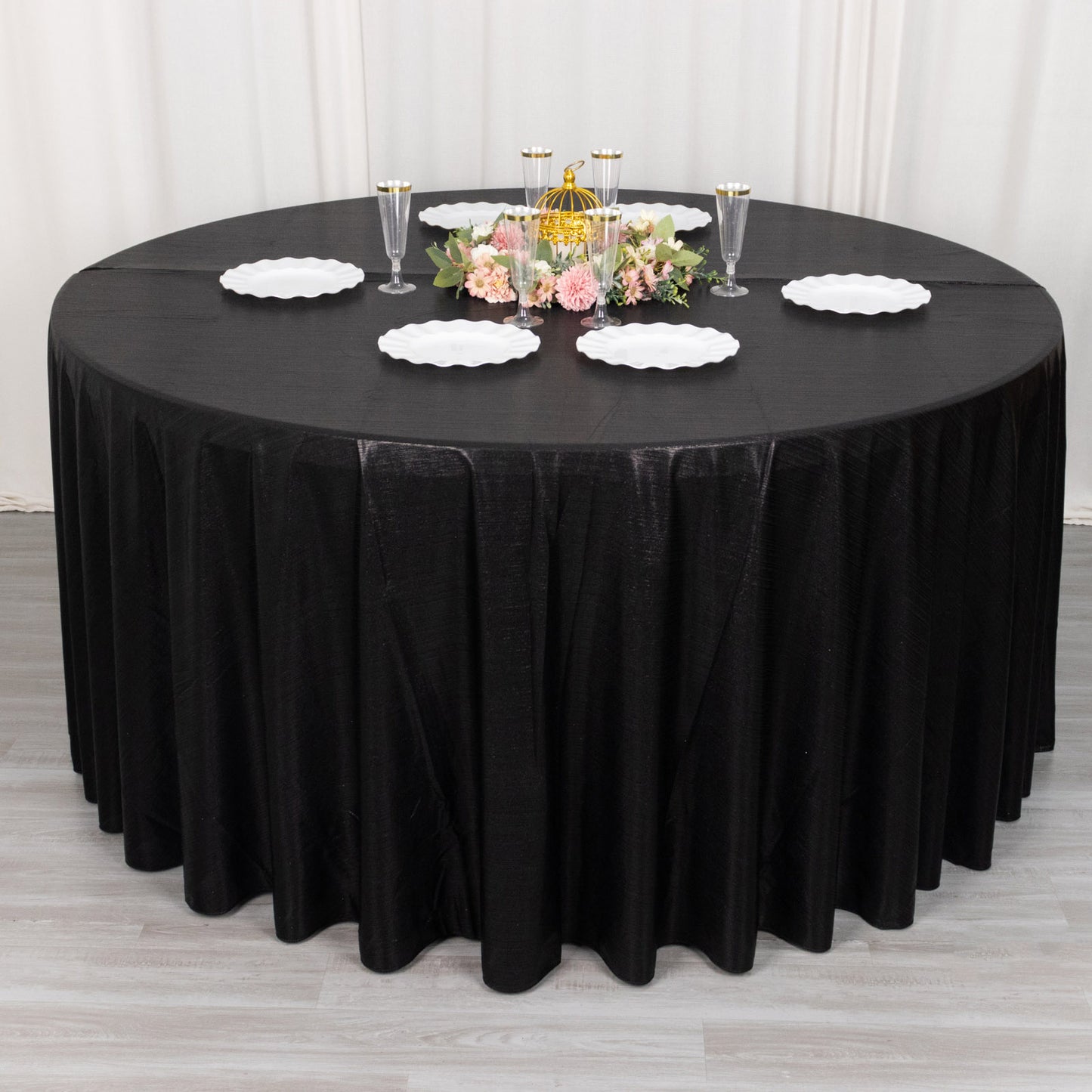 Black shimmer sequin tablecloth for elegant dining settings.