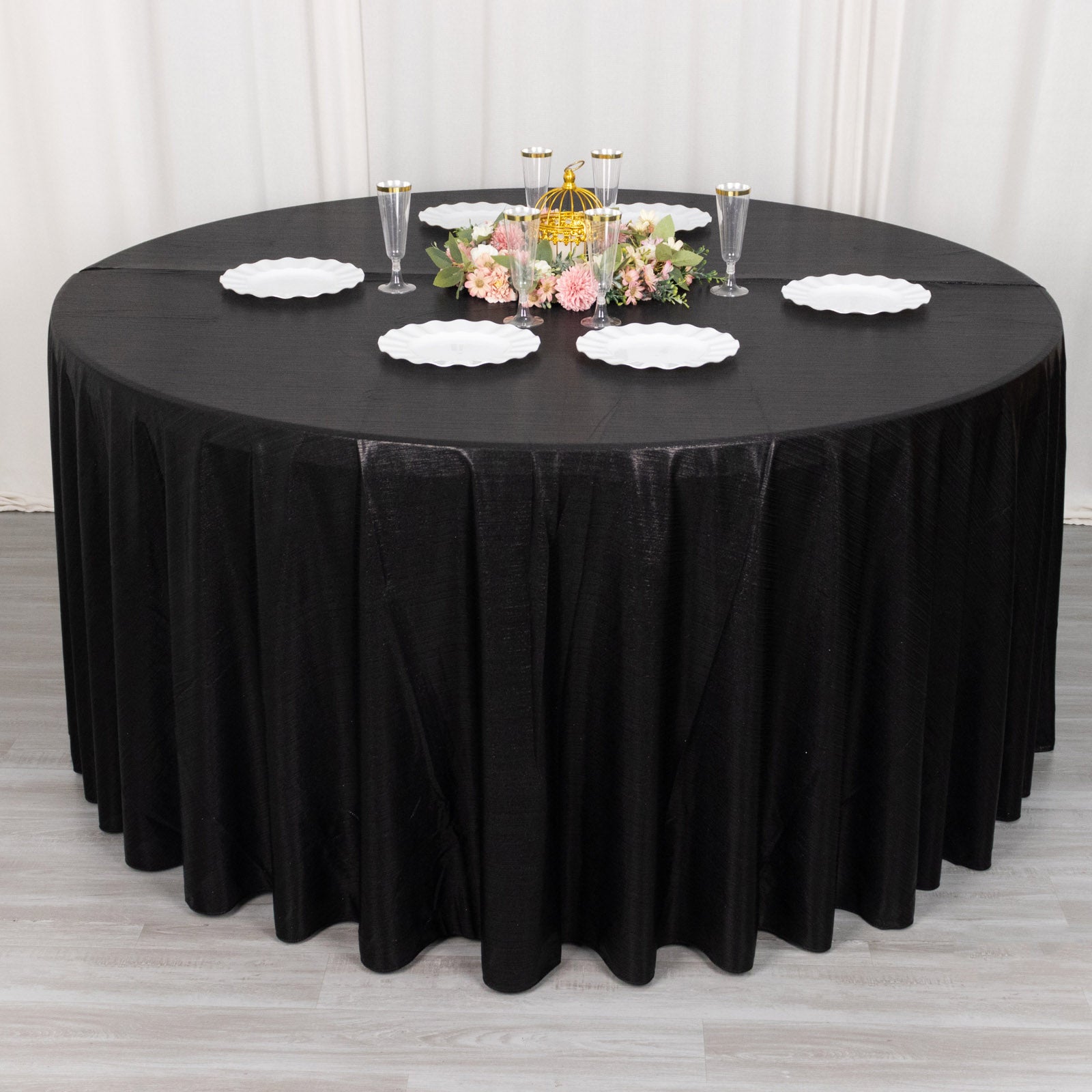 Black shimmer sequin tablecloth for elegant dining settings.