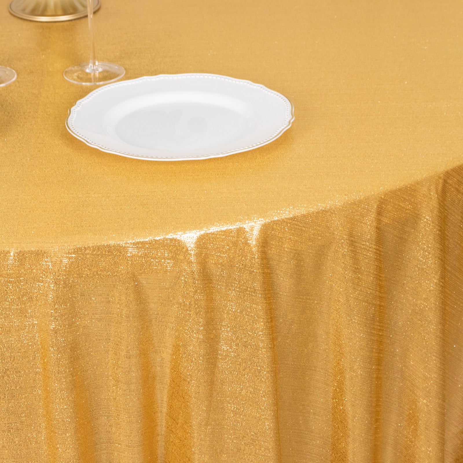 Gold shimmer sequin tablecloth for elegant events and parties.