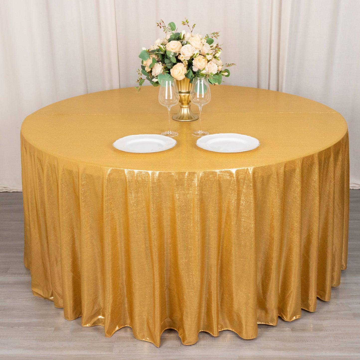 Gold shimmer sequin tablecloth with wrinkle-free sparkle finish.