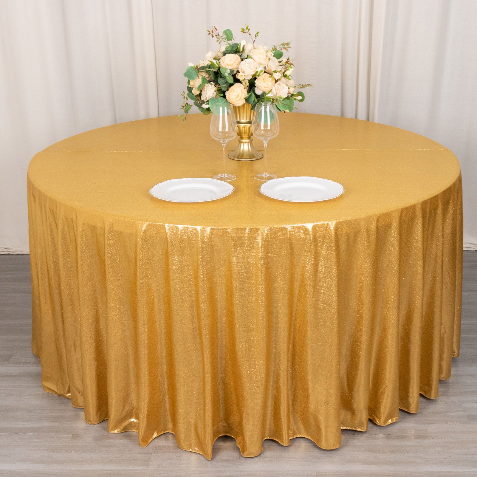 Gold shimmer sequin tablecloth with wrinkle-free sparkle finish.