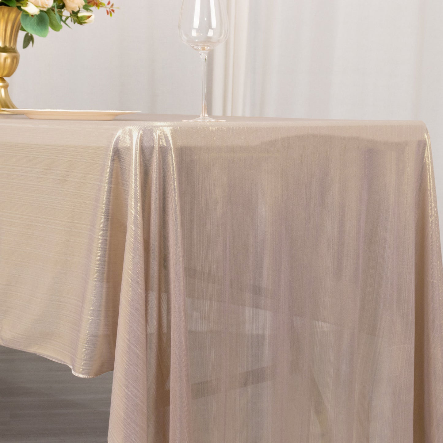 Shiny blush polyester tablecloth with shimmer sequin dots.