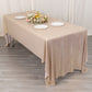 Shiny blush rectangular tablecloth with shimmer sequin dots on a dining table.