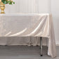 Shiny beige rectangular tablecloth with shimmer sequin dots on a table.