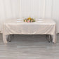 Shiny beige rectangular tablecloth with shimmer sequin dots on a table.