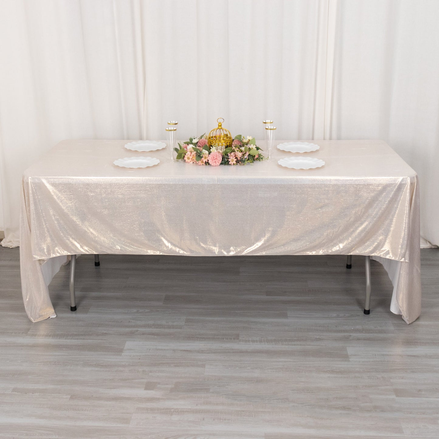 Shiny beige rectangular tablecloth with shimmer sequin dots on a table.