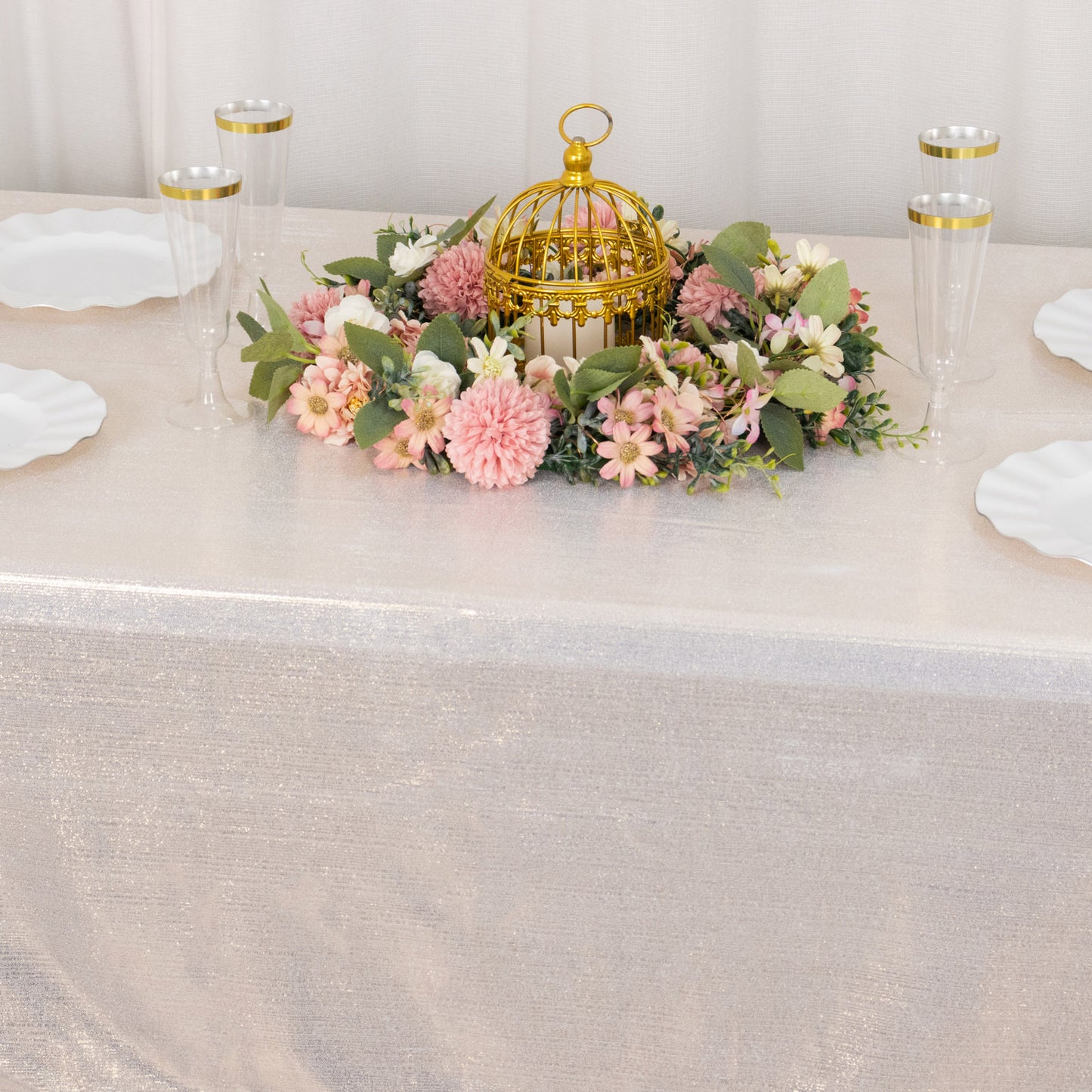 Shiny beige rectangular tablecloth with shimmer sequin dots on a decorated table.