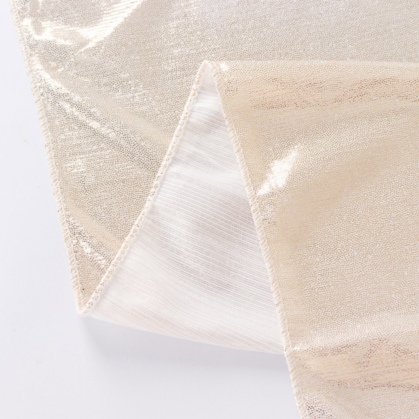 Shiny beige rectangular tablecloth with shimmer sequin dots.