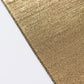 Shiny antique gold polyester tablecloth with sequin dots.