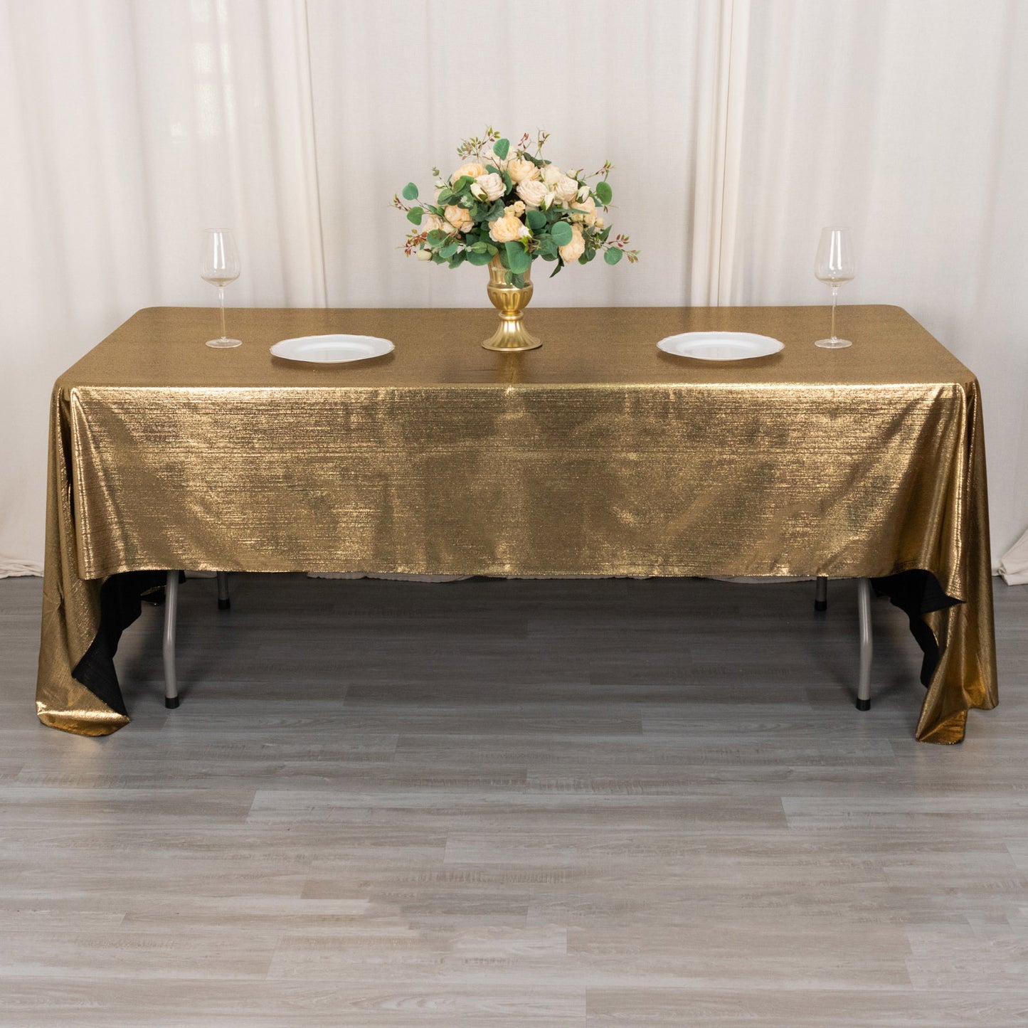Shiny antique gold polyester tablecloth with shimmer sequin dots.