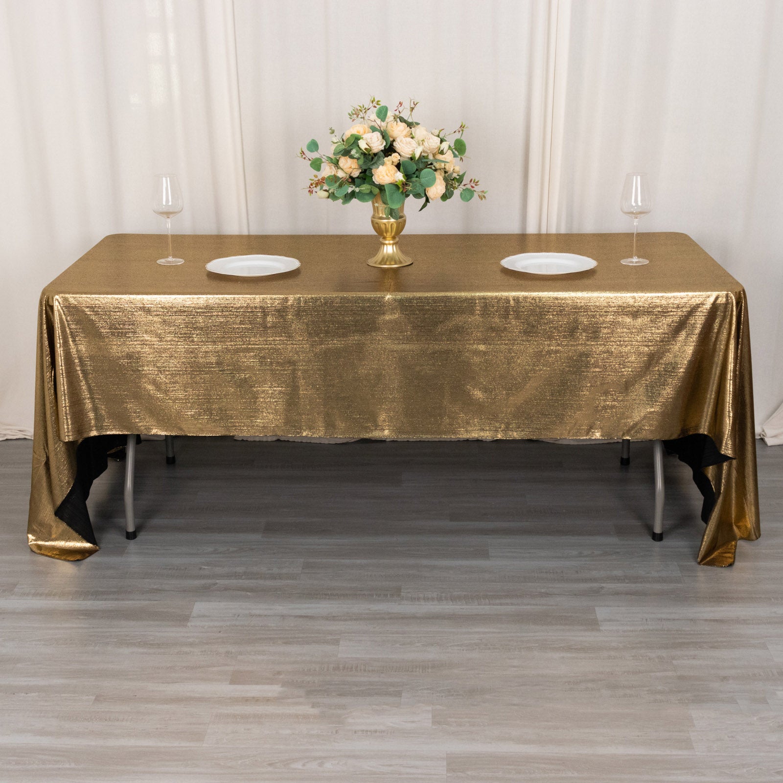 Shiny antique gold polyester tablecloth with shimmer sequin dots.