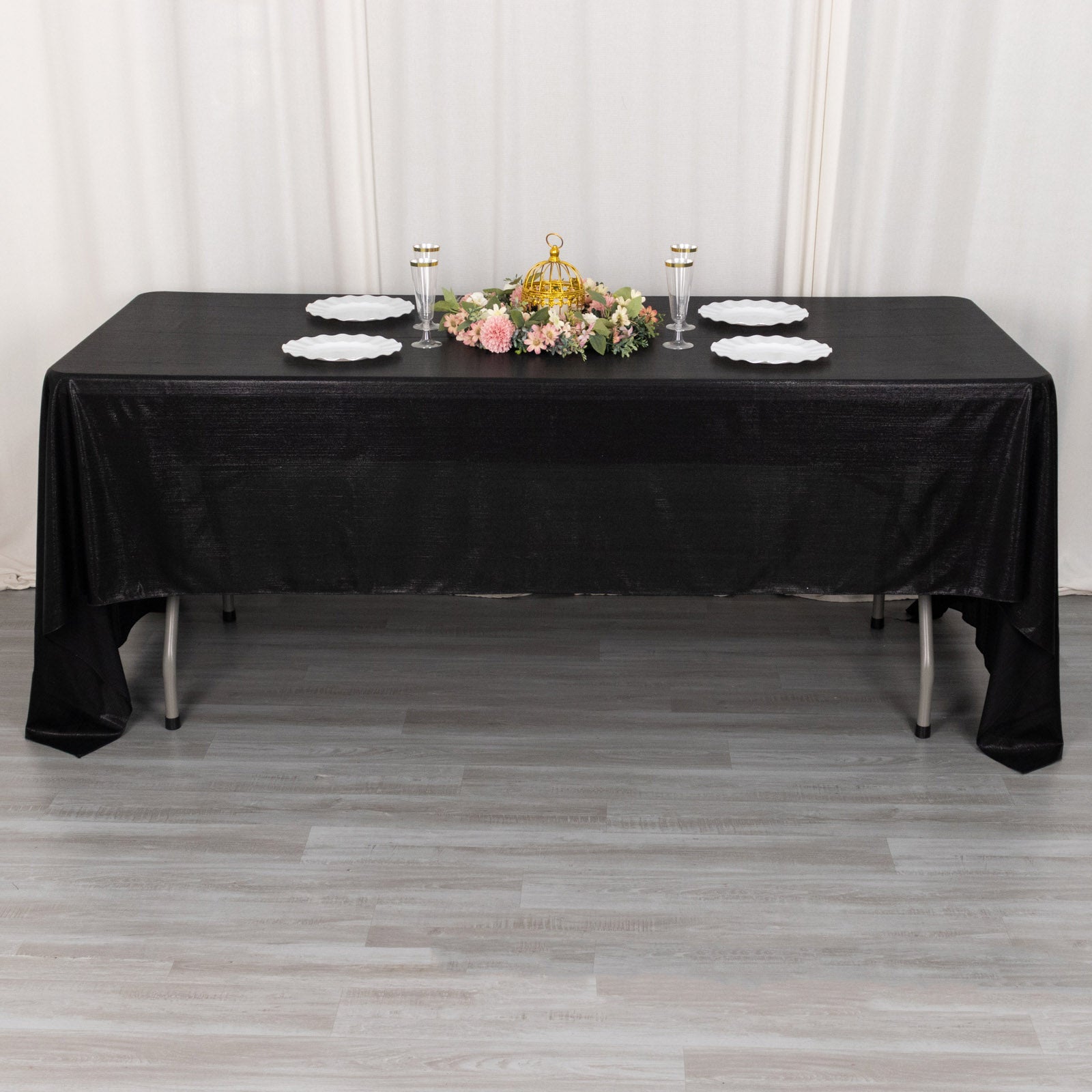 Shiny black rectangular tablecloth with shimmer sequin dots.